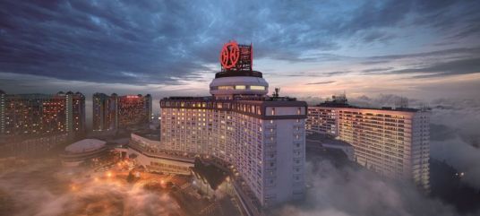 High capital expenditures impact financial metrics; S&P downgrades Genting Group's outlook to 'negative'.