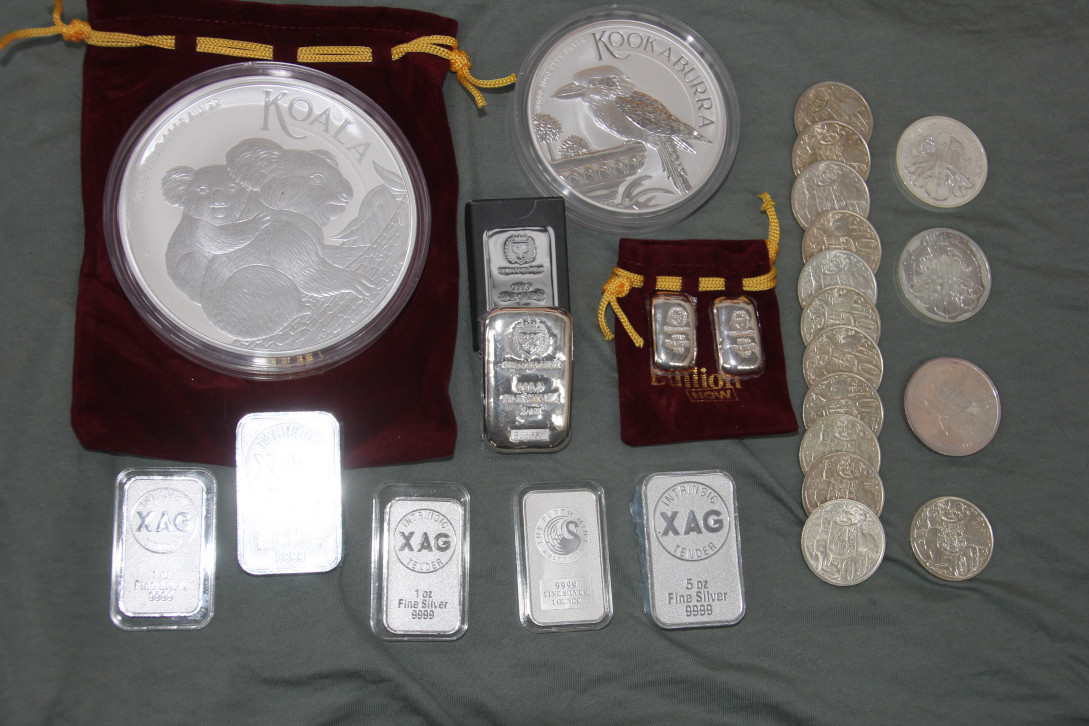 $XAG/USD (XAGUSD.FX)$ Stumbled on some coins I bought in last 5 years which was good to see, made me feel refreshed so I took a pic to share with you guys, hope it cheers you all up a bit LOL. 9999 Perth Mint 1kg Koala coin, 10 oz Kookaburra coin these are actually legal tender LOL, Some XAG, Germania 1 and 5oz bars, some Philharmonics, Maple, and 80% 1966 pre/post decimal (constitutional) silver 50c coins (3 coins equal 1 oz)